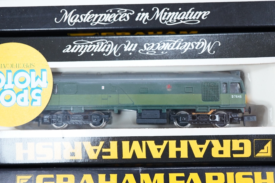 Four boxed Graham Farish N gauge railway diesel locomotives; a BR class 31, D5558 (8064), a Regional Railways class 31, Wigan Pier 31421 (8067), an EWS class 31, 31466, (806B) and a BR class 25, D7645 (8304).